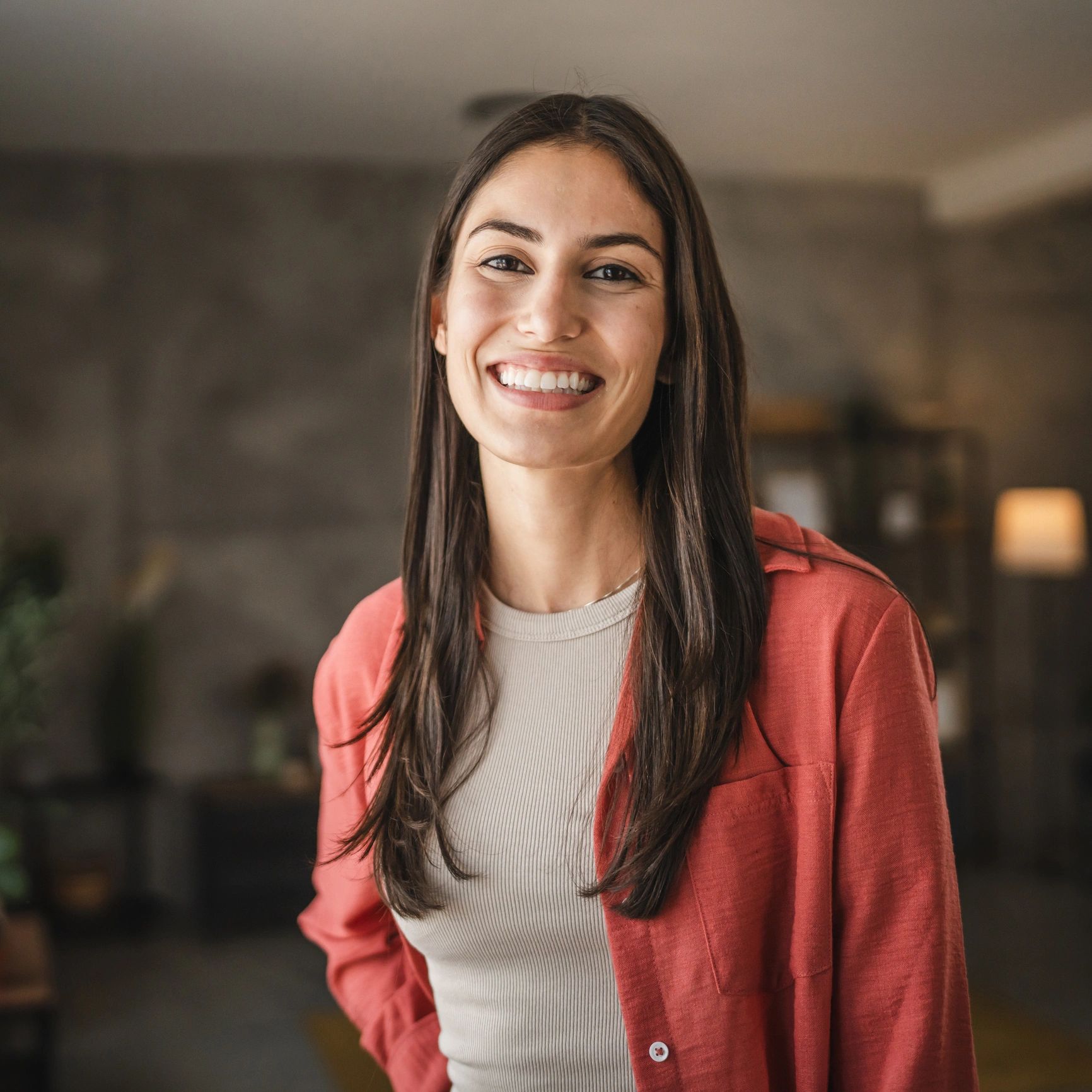 Young woman smiling naturally at home