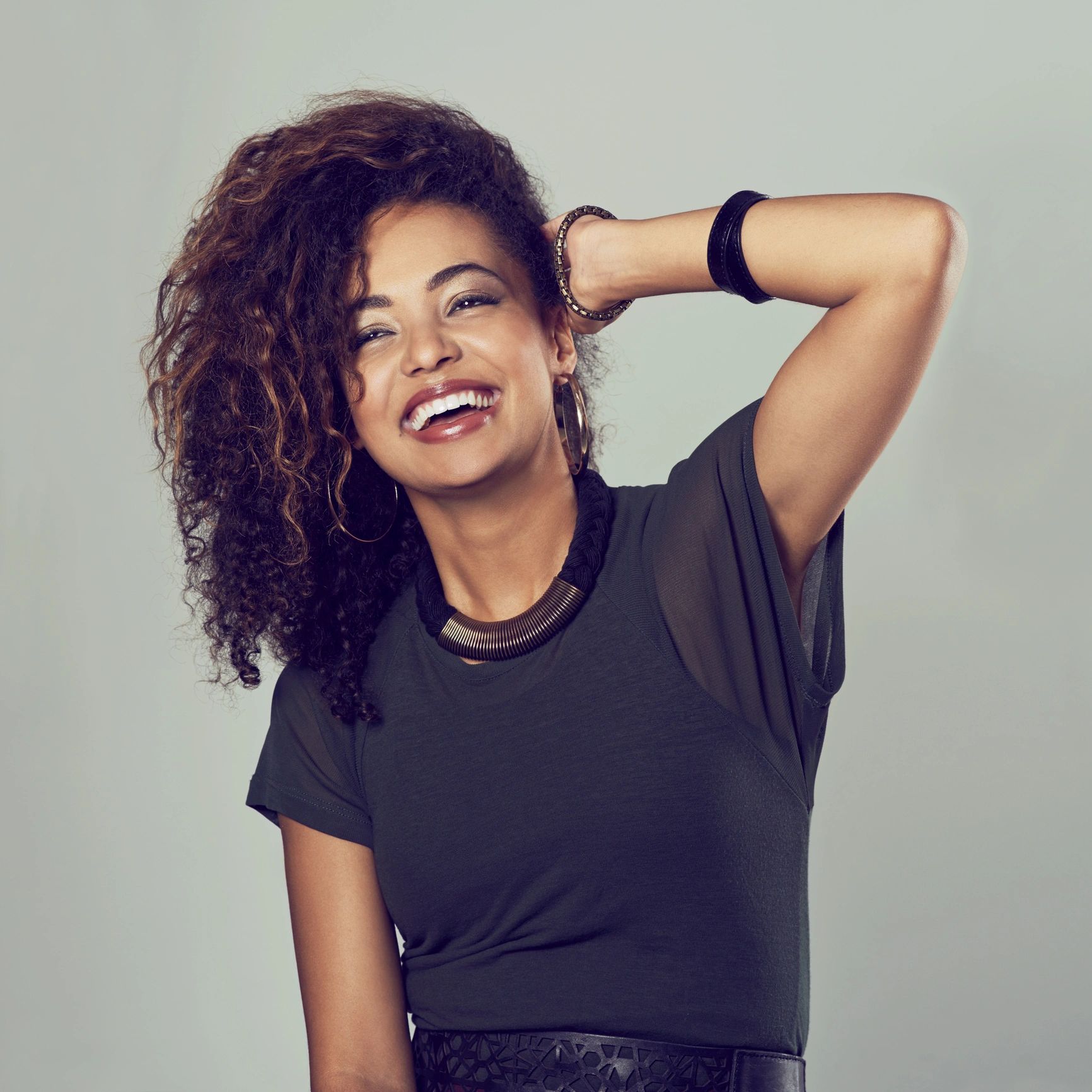 Attractive young woman smiling in studio